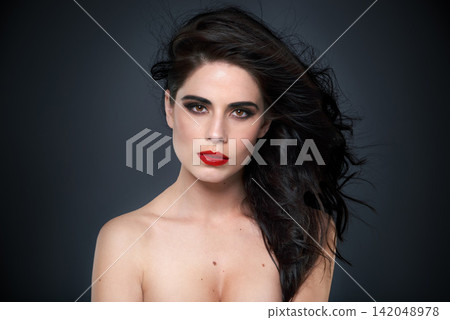 Face, woman and makeup or hair for beauty, bold color and eyeshadow on black background. Eyeliner, red lipstick and haircare shine with treatment in portrait, cosmetics and cosmetology for glamour 142048978