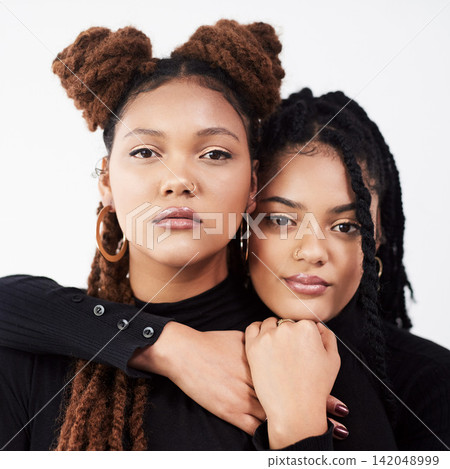 Attitude, portrait or serious sister black family in studio on white background for natural beauty. Braids, face and women with confident sibling people together for cosmetics, support or love Attitude, portrait or serious sister black family in studio on white background for natural beauty. Braids, face and women with confident sibling people together for cosmetics, support or love 142048999