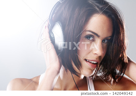 Portrait, music and woman on headphones in studio for podcast and media isolated on a white background. Face, radio and person listening to audio, sound and streaming kpop on technology in Germany Portrait, music and woman on headphones in studio for podcast and media isolated on a white background. Face, radio and person listening to audio, sound and streaming kpop on technology in Germany 142049142