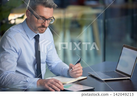 Businessman, tablet and notebook in office writing for communication, corporate research and company information. Technology, male person and working online for website, social media or sales Businessman, tablet and notebook in office writing for communication, corporate research and company information. Technology, male person and working online for website, social media or sales 142049213