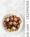 baby grilled octopus with golden baked potatoes and fresh herbs, Maltese cuisine, homemade, no people, 142049266