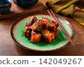 Chinese-style meat with sesame seeds and green onions, on a wooden table, homemade, no people, 142049267