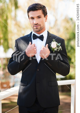 Man, portrait and groom in suit on wedding day outdoor or flower boutonniere, commitment or celebration. Male person, face and marriage reception or summer ceremony in garden park, milestone or event Man, portrait and groom in suit on wedding day outdoor or flower boutonniere, commitment or celebration. Male person, face and marriage reception or summer ceremony in garden park, milestone or event 142049345