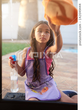 Spray bottle, cloth and kid cleaning window to prevent dirt, germs or bacteria outdoor at home. Detergent, hygiene and girl child wipe glass door for sanitizing in backyard at house for chores. Spray bottle, cloth and kid cleaning window to prevent dirt, germs or bacteria outdoor at home. Detergent, hygiene and girl child wipe glass door for sanitizing in backyard at house for chores. 142049444