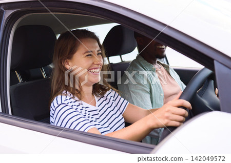 Couple, car and love with window for road trip, travel together and happiness. Happy woman, man and driving in transport for romantic vacation, relaxing weekend and fun adventure with holiday journey Couple, car and love with window for road trip, travel together and happiness. Happy woman, man and driving in transport for romantic vacation, relaxing weekend and fun adventure with holiday journey 142049572