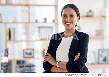Portrait, business and woman with arms crossed, professional in modern office and attorney. Face, person and employee with pride for career or affirmative action with lawyer or opportunity with smile Portrait, business and woman with arms crossed, professional in modern office and attorney. Face, person and employee with pride for career or affirmative action with lawyer or opportunity with smile 142049587