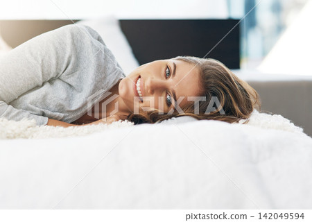 Morning, portrait and girl in bed to wake up or relax for weekend, break or wellness in home. Lying down, happy woman or person resting in apartment, house or morning for day off, holiday or vacation Morning, portrait and girl in bed to wake up or relax for weekend, break or wellness in home. Lying down, happy woman or person resting in apartment, house or morning for day off, holiday or vacation 142049594