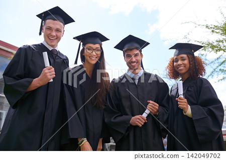 Portrait, achievement and students with graduation, outdoor and celebration with education and certificate. Knowledge, group and people with robe and degree with friends on campus, smile and success Portrait, achievement and students with graduation, outdoor and celebration with education and certificate. Knowledge, group and people with robe and degree with friends on campus, smile and success 142049702