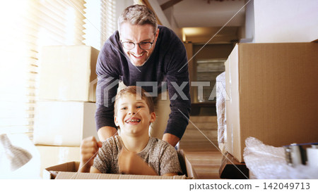 Real estate, box or father and son in new house with pushing, games and investment celebration. Property, renovation and happy family with cardboard fun, freedom and bonding in dream home together Real estate, box or father and son in new house with pushing, games and investment celebration. Property, renovation and happy family with cardboard fun, freedom and bonding in dream home together 142049713