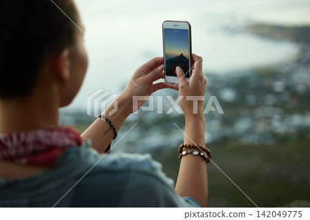 Woman, smartphone and picture on mountain for social media, sunset and adventure for holiday. Influencer, mobile and travel on cliff for cityscape, relax and female person in nature for vacation Woman, smartphone and picture on mountain for social media, sunset and adventure for holiday. Influencer, mobile and travel on cliff for cityscape, relax and female person in nature for vacation 142049775