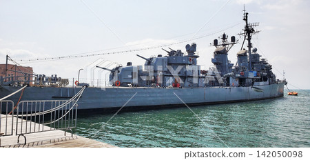 A warship moored at the dock. A warship moored at the dock. 142050098