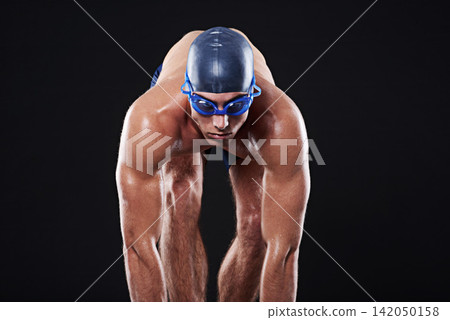 Studio, sports and athlete ready to dive for marathon, competition and cardio exercise for workout. Fitness, swimmer and man with start pose for swimming and training on black background 142050158