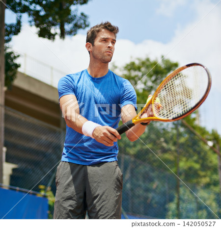 Man, racket and serve in outdoor tennis match, game and court for competition or practice. Male person, athlete and ready for training or exercise, workout and hobby for action and play fitness Man, racket and serve in outdoor tennis match, game and court for competition or practice. Male person, athlete and ready for training or exercise, workout and hobby for action and play fitness 142050527
