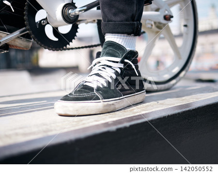 Sneaker, man and riding bike in city, fitness and energy with fashion, gen z and stylish with fun. Person, outdoor or guy with trendy shoes, wellness or sunshine with biker, cycling and eco transport Sneaker, man and riding bike in city, fitness and energy with fashion, gen z and stylish with fun. Person, outdoor or guy with trendy shoes, wellness or sunshine with biker, cycling and eco transport 142050552