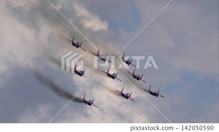 Zhukovsky Russia July 22 2021 Strizhi aerobatic team flying MiG-29 fighter jets during an aerobatic performance at the MAKS International Aviation and Space Salon Zhukovsky Russia July 22 2021 Strizhi aerobatic team flying MiG-29 fighter jets during an aerobatic performance at the MAKS International Aviation and Space Salon 142050590