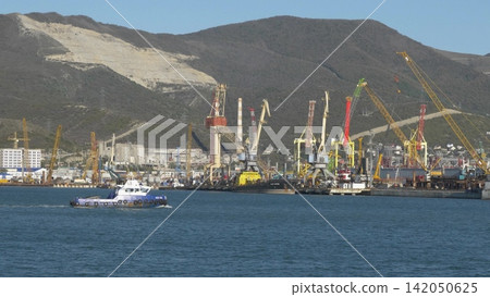 Novorossiysk Russia June 28 2026 Rescue vessel tug HCC 1002 sailing in the commercial seaport of Novorossiysk on a sunny day 142050625