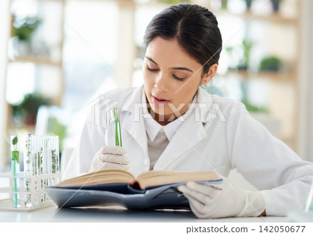 Woman, scientist and plants with notebook in lab for study of botany or ecology with biotechnology. Female specialist or doctor, research and record results or medical of experiment or test for work. Woman, scientist and plants with notebook in lab for study of botany or ecology with biotechnology. Female specialist or doctor, research and record results or medical of experiment or test for work. 142050677