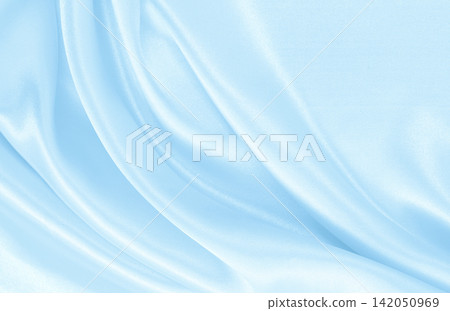 Smooth elegant blue silk or satin luxury cloth texture as abstract background. Luxurious background design Smooth elegant blue silk or satin luxury cloth texture as abstract background. Luxurious background design 142050969