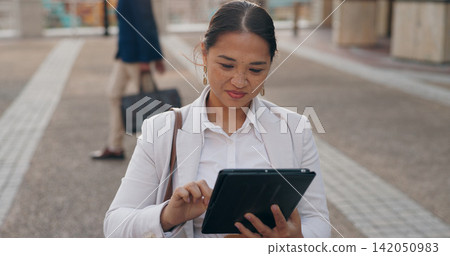 Asian woman, business and browsing with tablet in city for research, social media or outdoor networking. Female person or employee with smile on technology for online search, web or internet in town Asian woman, business and browsing with tablet in city for research, social media or outdoor networking. Female person or employee with smile on technology for online search, web or internet in town 142050983