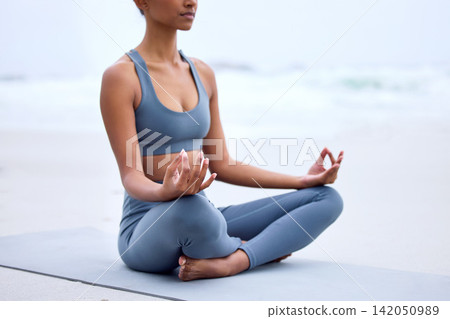 Yoga, lotus meditation and hands at ocean for mindfulness, peace or calm to relax at sea in nature. Zen, beach and woman in padmasana pose for exercise, fitness and wellness for body health outdoor Yoga, lotus meditation and hands at ocean for mindfulness, peace or calm to relax at sea in nature. Zen, beach and woman in padmasana pose for exercise, fitness and wellness for body health outdoor 142050989
