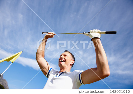 Happy man, winning and golfer with club in celebration for victory, achievement or point with blue sky. Excited male person or sports player with smile for score, par or hole in one at golf course Happy man, winning and golfer with club in celebration for victory, achievement or point with blue sky. Excited male person or sports player with smile for score, par or hole in one at golf course 142051010