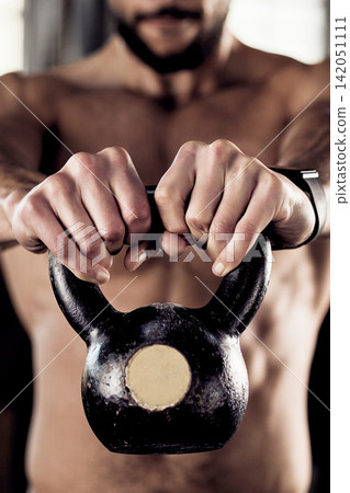 Hands, kettlebell and man in gym, exercise or strength training with equipment, health or fitness. Closeup, person or bodybuilder in wellness center, workout or strong with challenge or weightlifting Hands, kettlebell and man in gym, exercise or strength training with equipment, health or fitness. Closeup, person or bodybuilder in wellness center, workout or strong with challenge or weightlifting 142051111
