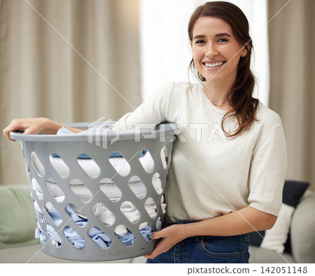 Home, laundry and portrait of woman with basket for cleaning, housekeeping and hygiene of fabric. Textile, linen and female person with washing in container for material, care and routine on weekend Home, laundry and portrait of woman with basket for cleaning, housekeeping and hygiene of fabric. Textile, linen and female person with washing in container for material, care and routine on weekend 142051148