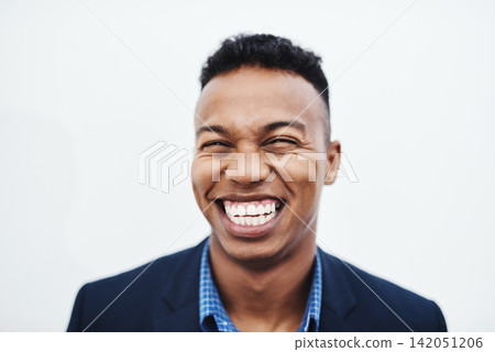 Happy, face and businessman laughing in studio with funny, teeth and feel good mood, confidence or personality on white background. Comic, silly and African model smile for goofy joke or comedy Happy, face and businessman laughing in studio with funny, teeth and feel good mood, confidence or personality on white background. Comic, silly and African model smile for goofy joke or comedy 142051206