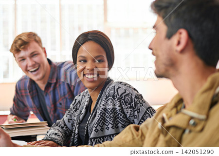 Students, friends and studying in discussion with books, smile and diversity in library for education. Men, woman and group at university, plan and talking for solution, planning and ready for exam Students, friends and studying in discussion with books, smile and diversity in library for education. Men, woman and group at university, plan and talking for solution, planning and ready for exam 142051290