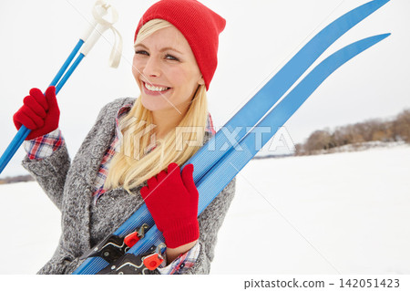 Woman, portrait and happy on vacation with ski equipment for alpine adventure, fun and exploring snowy wilderness. Girl, smile and outdoor on winter holiday in Alaska for getaway and travel tour. Woman, portrait and happy on vacation with ski equipment for alpine adventure, fun and exploring snowy wilderness. Girl, smile and outdoor on winter holiday in Alaska for getaway and travel tour. 142051423