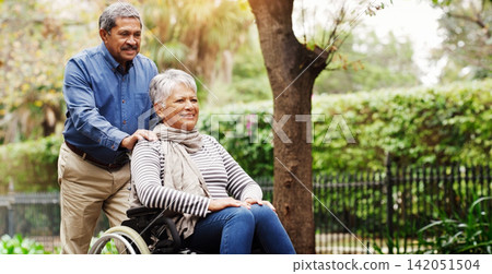 Elderly man, woman and wheelchair in park by trees with love, care and happy on vacation in summer. Senior people, old couple and person with disability in nature for rehabilitation in retirement Elderly man, woman and wheelchair in park by trees with love, care and happy on vacation in summer. Senior people, old couple and person with disability in nature for rehabilitation in retirement 142051504