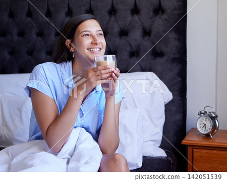 Girl, tea and smile in bed, morning and thinking with vision, choice and future with pyjamas in apartment. Woman, person and relax in bedroom with drink, coffee and happy for ideas at house in Naples 142051539