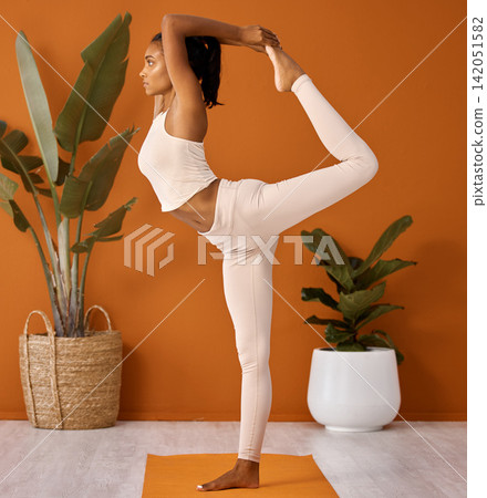 Yoga, king dance and woman stretching leg for fitness, wellness and body health in home. Natarajasana, pilates and flexibility for exercise, balance or serious Indian girl in holistic performance Yoga, king dance and woman stretching leg for fitness, wellness and body health in home. Natarajasana, pilates and flexibility for exercise, balance or serious Indian girl in holistic performance 142051582