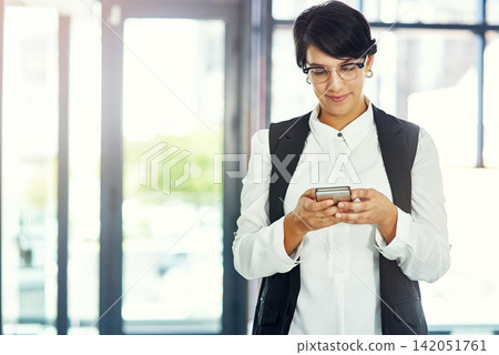 Office, business and woman and typing on smartphone, web search and internet browsing or mobile connection. Communication, technology and smile online or happy for notification, text and professional Office, business and woman and typing on smartphone, web search and internet browsing or mobile connection. Communication, technology and smile online or happy for notification, text and professional 142051761