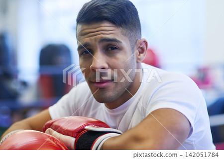Gym, boxer or man in portrait for workout, exercising and training for competition. Professional, male athlete and break in ring relaxing or resting, commitment and mma fighter with motivation Gym, boxer or man in portrait for workout, exercising and training for competition. Professional, male athlete and break in ring relaxing or resting, commitment and mma fighter with motivation 142051784