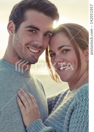 Portrait, couple and hug with love on beach for romantic getaway on weekend for anniversary and embrace on vacation. Man, woman and bonding together for intimacy or care, affection and summer holiday 142051957