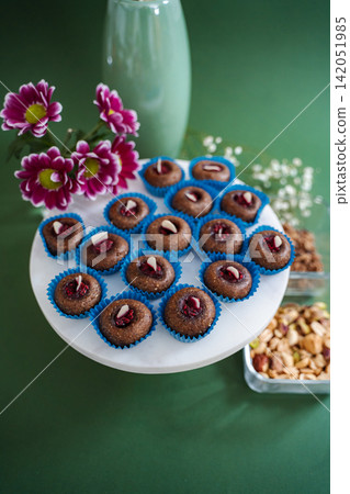 Healthy energy balls with chocolate and nuts on a marble platter Healthy energy balls with chocolate and nuts on a marble platter 142051985