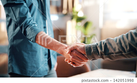Handshake, logistics and teamwork with people in office of factory together for delivery success. Agreement, supply chain and thank you with shipping team shaking hands in workplace for partnership 142051998