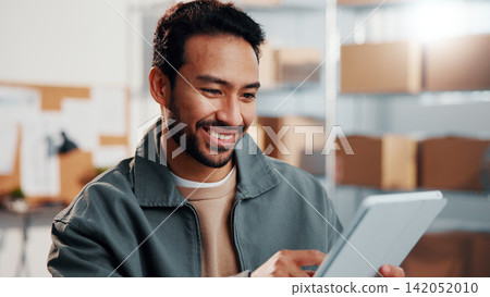 Ecommerce, man and smile in warehouse with tablet, sales target or notification for shipping success. Happy, male person and tech in small business with good review, online order and logistics goals. Ecommerce, man and smile in warehouse with tablet, sales target or notification for shipping success. Happy, male person and tech in small business with good review, online order and logistics goals. 142052010