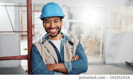 Worker, man and happy with arms crossed for construction, renovation project or skilled labor. Scaffolding, tradesman or smile with PPE on site for remodeling, industry expertise or building portrait 142052016