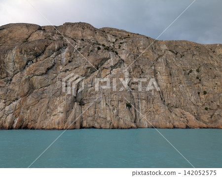Weathered Rock Face Along a Patagonian Glacial Lake Weathered Rock Face Along a Patagonian Glacial Lake 142052575