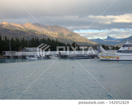 Puerto Punta Bandera, Argentina - March 11, 2026: Tourist Boats at Glacial Lake Harbor Puerto Punta Bandera, Argentina - March 11, 2026: Tourist Boats at Glacial Lake Harbor 142052829