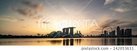 Sunset and skyscrapers of the business district viewed from Marina Bay Sunset and skyscrapers of the business district viewed from Marina Bay 142053631
