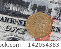 1879 Liberty Head Eagle Gold Coin on Vintage United States Banknote 142054383