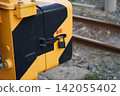 Crossing gates installed beside the railway tracks 142055402