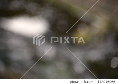 A background image featuring large, blurred stones laid out on the ground. A background image featuring large, blurred stones laid out on the ground. 142056066
