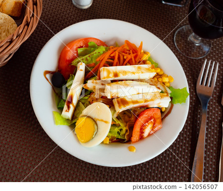 Salad of fresh tomatoes with cheese and eggs Salad of fresh tomatoes with cheese and eggs 142056507