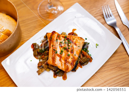 Salmon with vegetables and teriyaki sauce Salmon with vegetables and teriyaki sauce 142056551