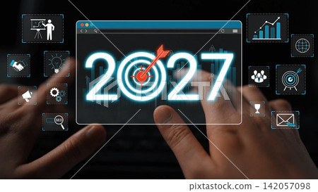 A close-up view of hands typing on a keyboard, accompanied by digital icons representing business analytics and future aspirations for the year 2027. Sigmoid A close-up view of hands typing on a keyboard, accompanied by digital icons representing business analytics and future aspirations for the year 2027. Sigmoid 142057098