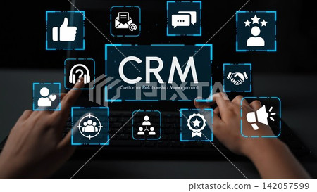 Hands Gesturing Towards Digital Customer Relationship Management Concept on Laptop Screen with Various Icon Symbols Representing Client Interaction and Engagement. Entropy Hands Gesturing Towards Digital Customer Relationship Management Concept on Laptop Screen with Various Icon Symbols Representing Client Interaction and Engagement. Entropy 142057599